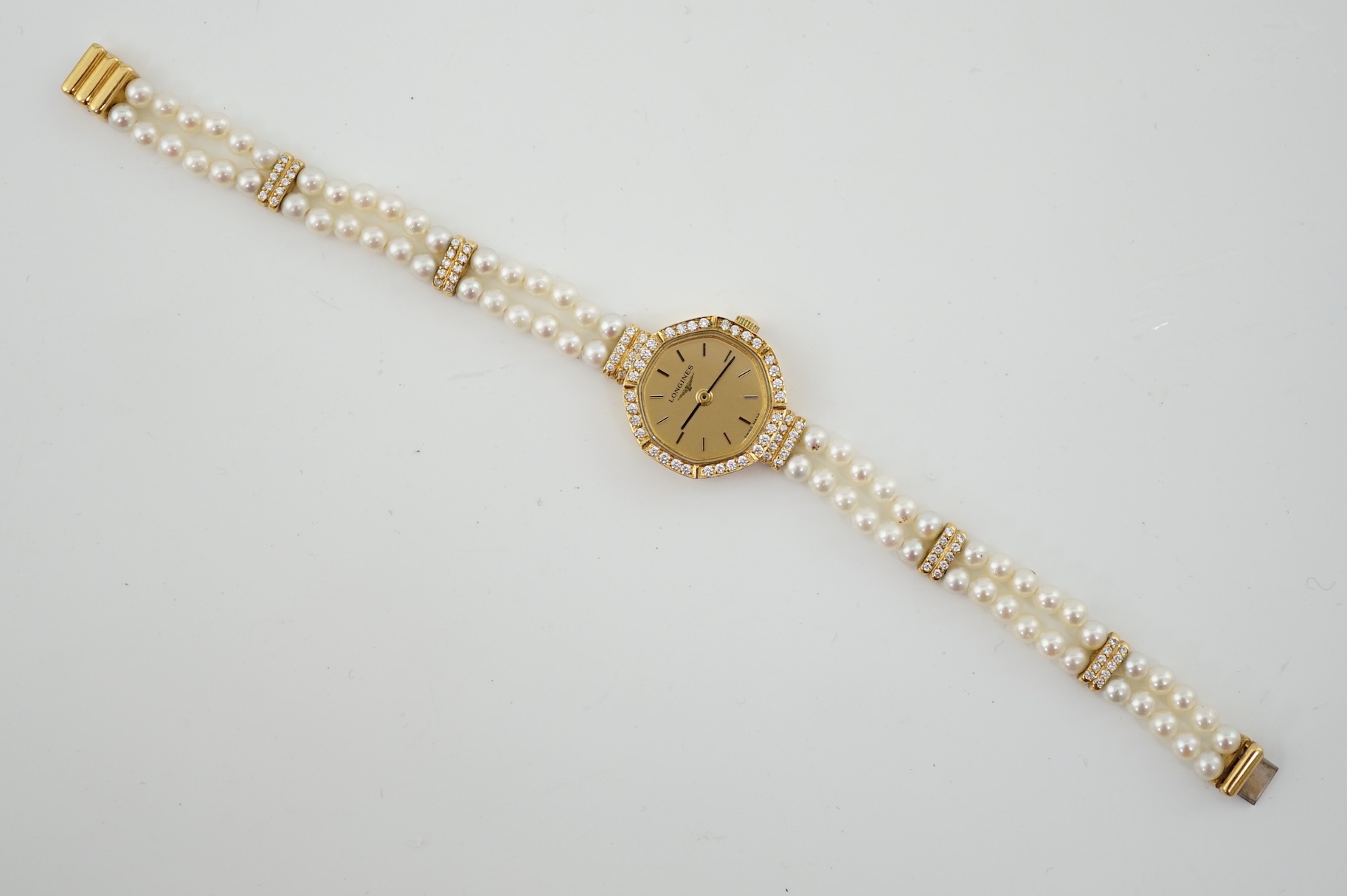 A lady's modern 18k and diamond chip set Longines quartz octagonal wrist watch